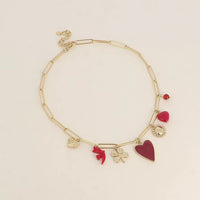 Collier - coeur martelé, oiseau en résine, coeur en émail, fleur, coeur en pierre naturelle