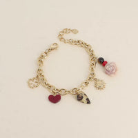 Bracelet - breloques (trèfle ajouré, coeur en résine, rose, soleil et perles)