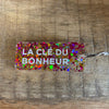 Porte-clés à paillettes Fuchsia / Or : LA CLÉ DU BONHEUR