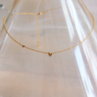 Collier fin en acier inoxydable avec 3 mini cœurs - or