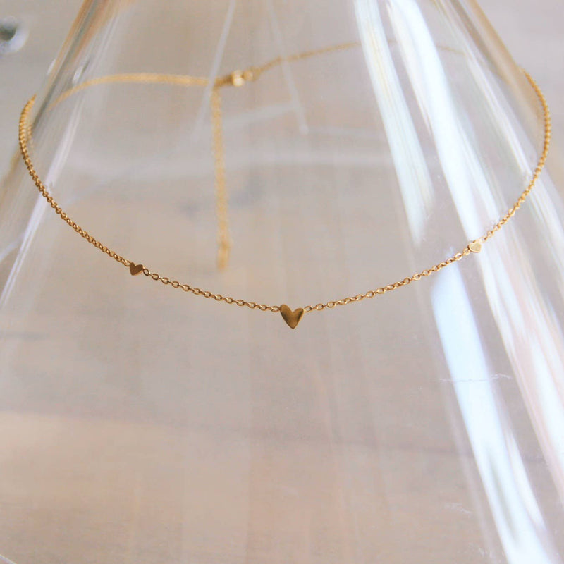 Collier fin en acier inoxydable avec 3 mini cœurs - or